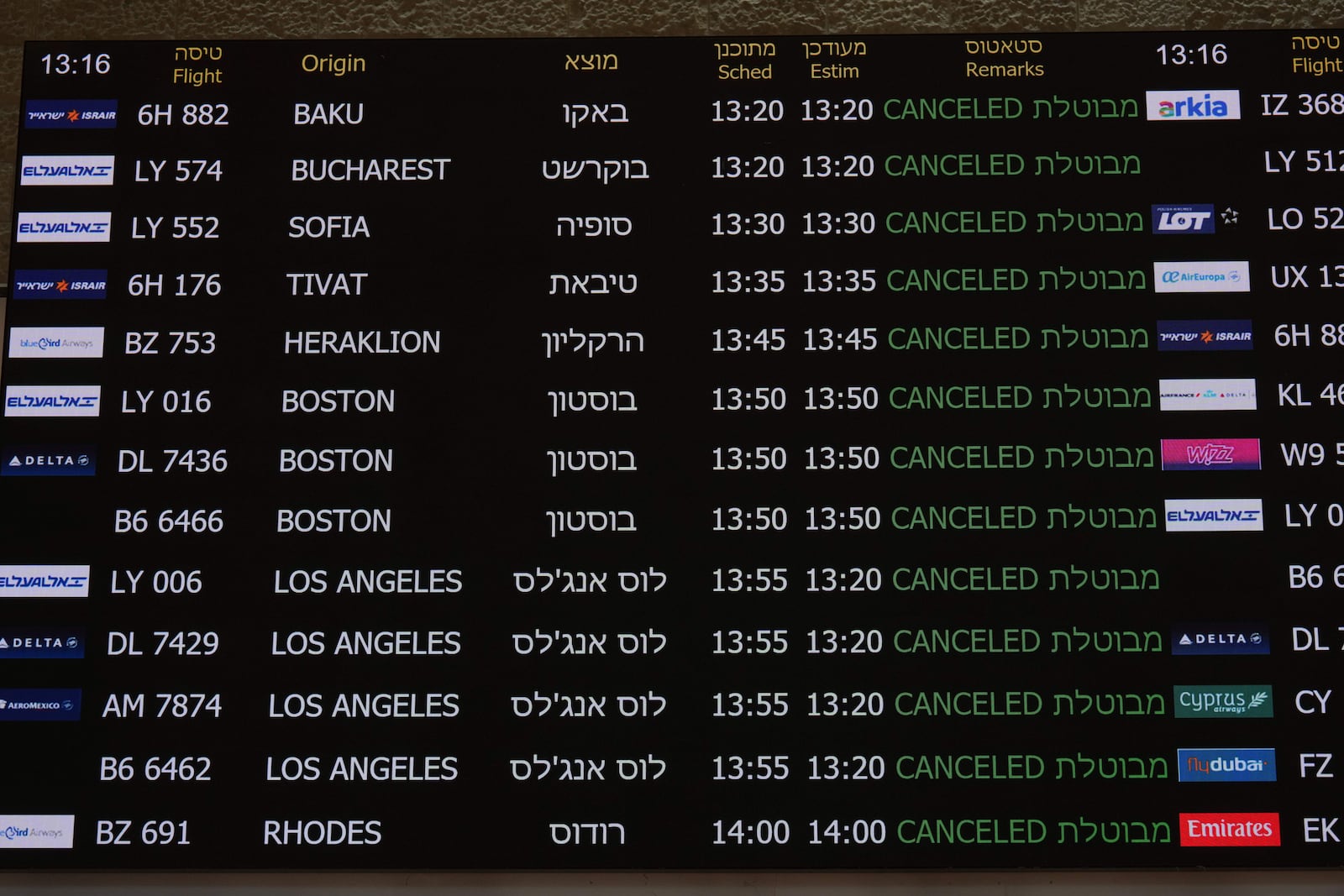 The flight information board at Israel's Ben Gurion Airport shows flight cancellations following an Israeli military strike on Iran, near Tel Aviv, Israel, Friday, June 13, 2025. (AP Photo/Ariel Schalit)
