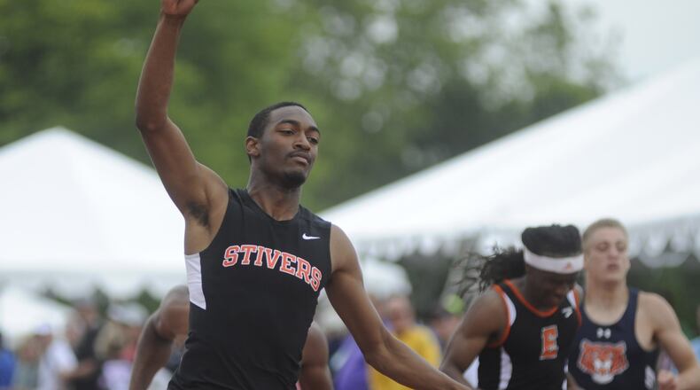 Tyler Johnson of Stivers (left) signals who’s No. 1 after winning the 200 during the D-II state track meet at OSU’s Jesse Owens Memorial Stadium at Columbus on Saturday, June 4, 2016. MARC PENDLETON / STAFF