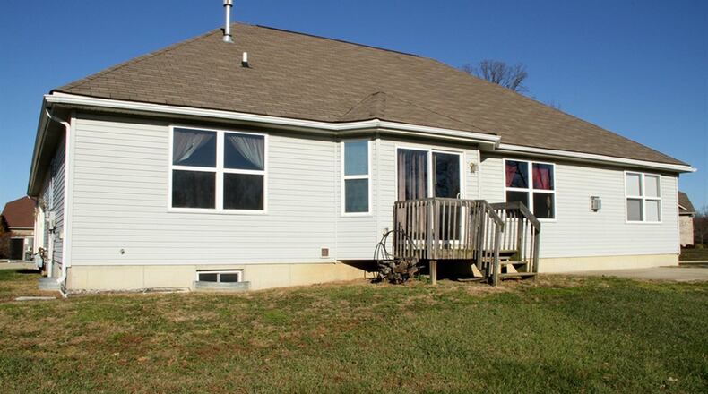 The bay bump-out breakfast room has a patio door that opens out to a small deck and the back yard.