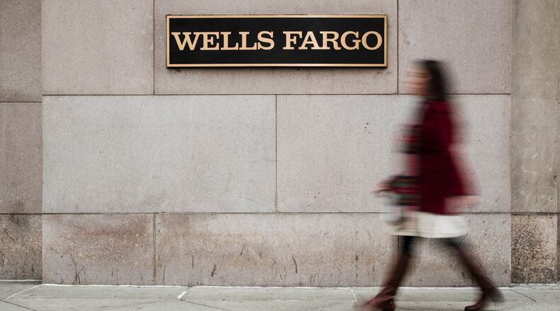 A 2018 file photo shows a Wells Fargo bank in Philadelphia. Wells Fargo has been so inundated with PPP loan applications, it has asked applicants to consider applying for the federal funds at other banks. (AP Photo/Matt Rourke, File)