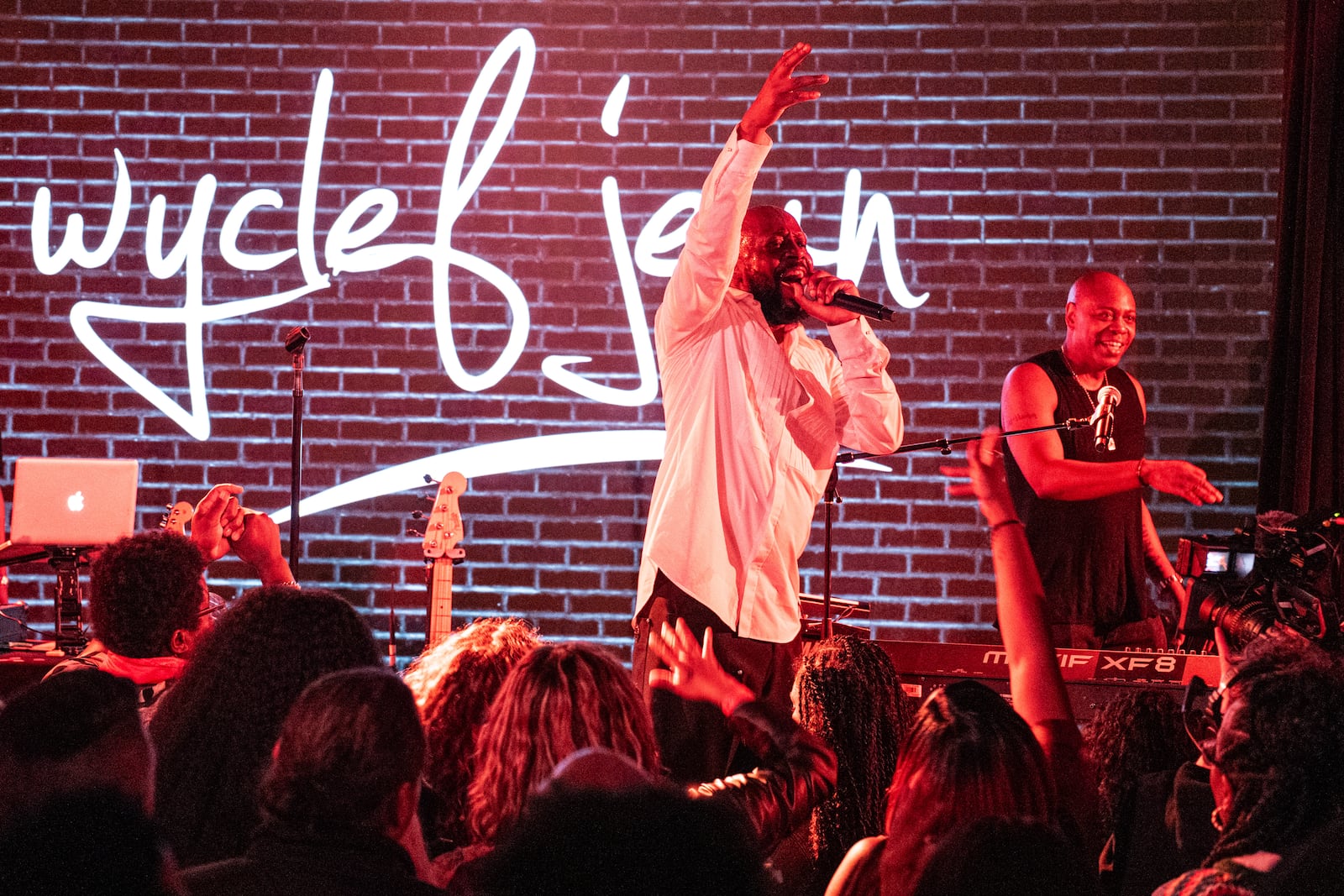Wyclef Jean (center) and Dave Chappelle perform at the Haitian Appreciation Show at the at the YS Firehouse on April 5. Mathieu Bitton/CONTRIBUTED PHOTO
