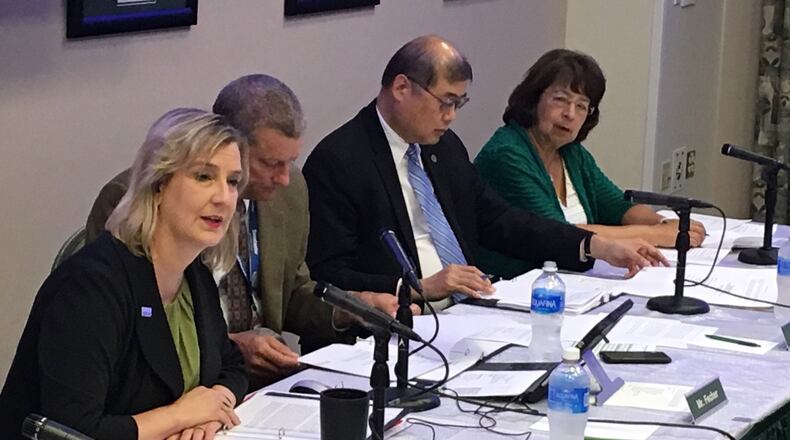 Wright State University president Cheryl Schrader, left, speaks during her first board of trustees meeting at the university. Schrader has been on the job for a little more than a month now.