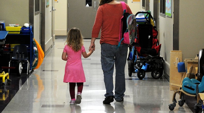 Jannet Pikos walks her daughter Mycah, 3, to preschool class at United Rehabilitation Services, 4710 Troy Pike in Montgomery County on Tuesday April 4, 2023. MARSHALL GORBY\STAFF