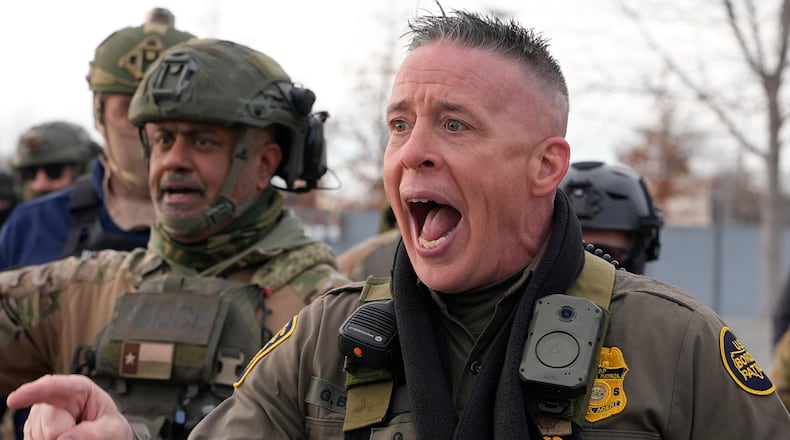 U.S. Border Patrol Cmdr. Gregory Bovino shouts at protesters, Sunday, Jan. 11, 2026, in Minneapolis. (AP Photo/Jen Golbeck)
