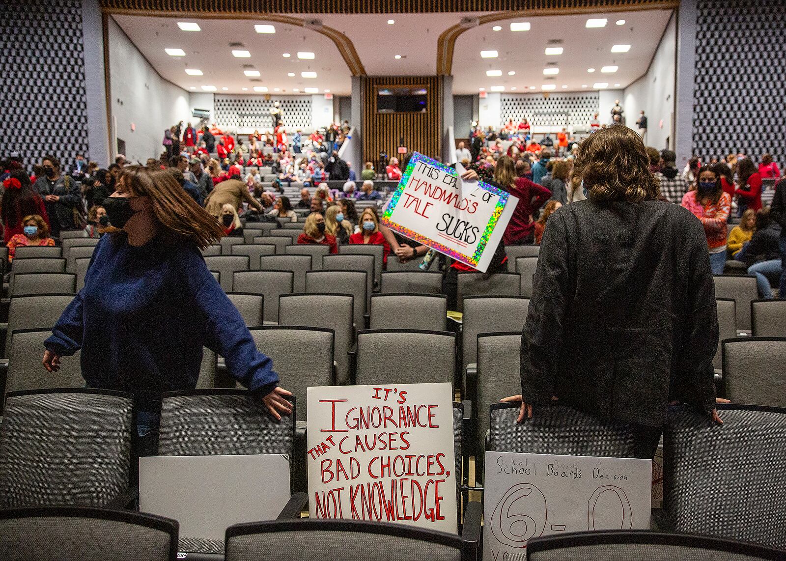 Spotsylvania County School Board meeting attendees begin to regroup before public comments at Chancellor High School in Spotsylvania County, Va. on Monday, Nov. 15, 2021. The Virginia school board rescinded a directive for staff to pull books with “sexually explicit” books from libraries early Tuesday after hours of passionate public comment. (Peter Cihelka/The Free Lance-Star via AP)