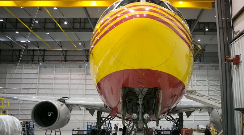 A Boeing 767 painted in DHL livery within a hangar at Airborne Maintenance and Engineering Services at the Wilmington Air Park. TY GREENLEES / STAFF