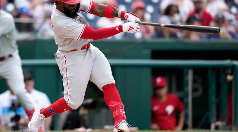 Philadelphia Phillies' Josh Harrison singles in the second inning of a baseball game against the Washington Nationals, Saturday, June 3, 2023, in Washington. J.T. Realmuto scored on the play. (AP Photo/Patrick Semansky)