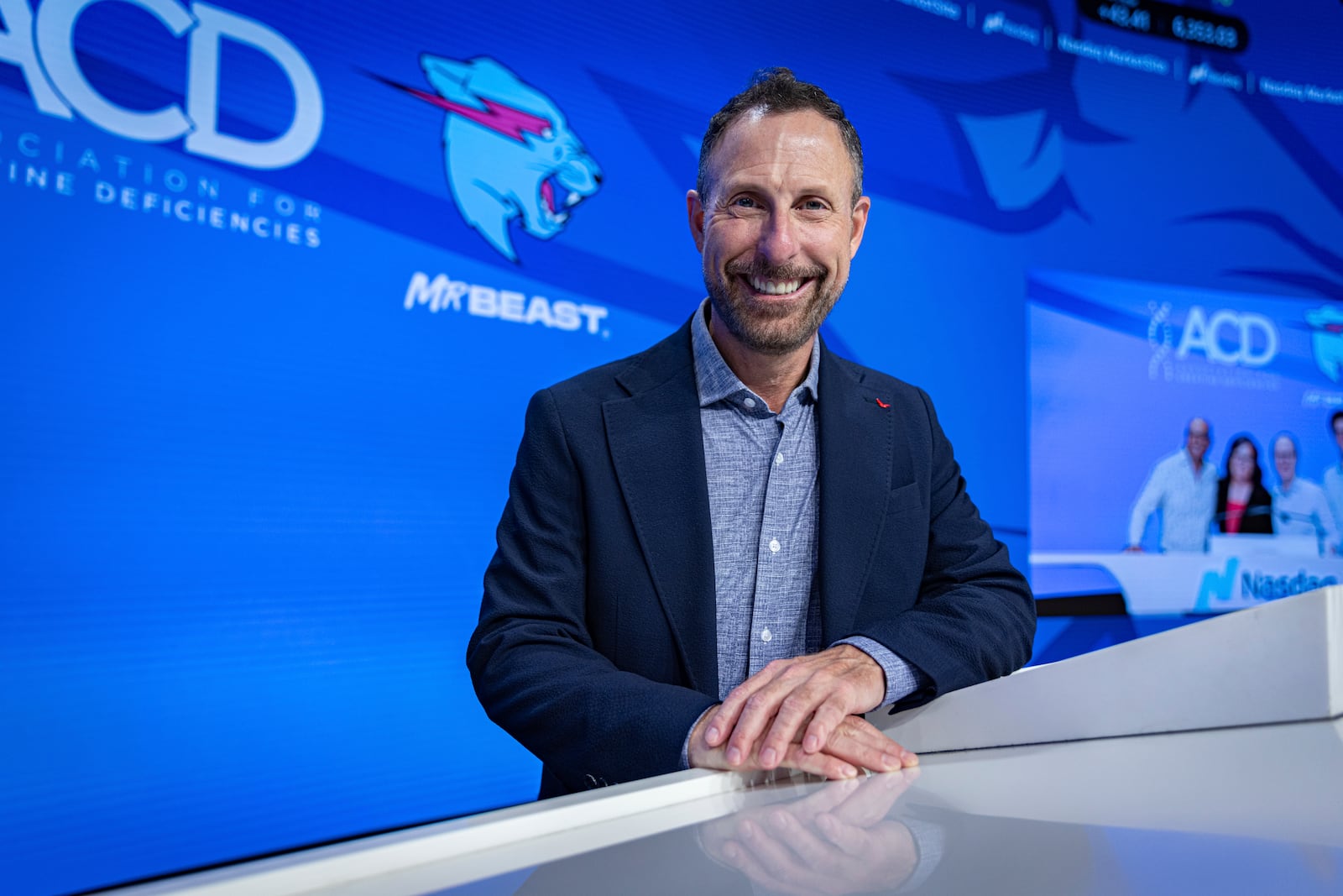 Jeffrey Housenbold, CEO and president of MrBeast, poses for a picture during a Nasdaq closing bell ceremony Wednesday, July 23, 2025, in New York's Times Square. (AP Photo/Stefan Jeremiah)
