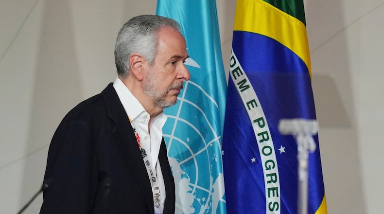 André Corrêa do Lago, COP30 president, arrives back into a plenary session at the COP30 U.N. Climate Summit, Saturday, Nov. 22, 2025, in Belem, Brazil. (AP Photo/Andre Penner)