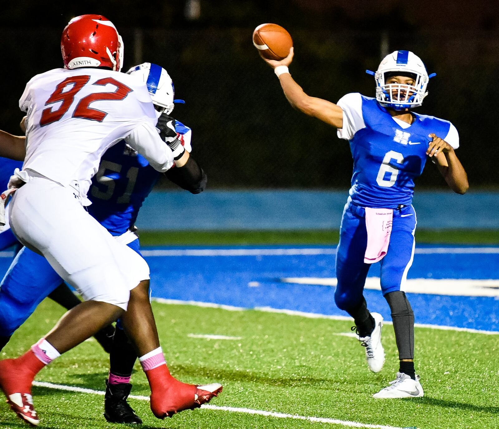 Hamilton quarterback Khaliyal Sowell unloads a pass before Princeton’s Darrion Henry (92) can get to him Friday night at Virgil Schwarm Stadium in Hamilton. NICK GRAHAM/STAFF