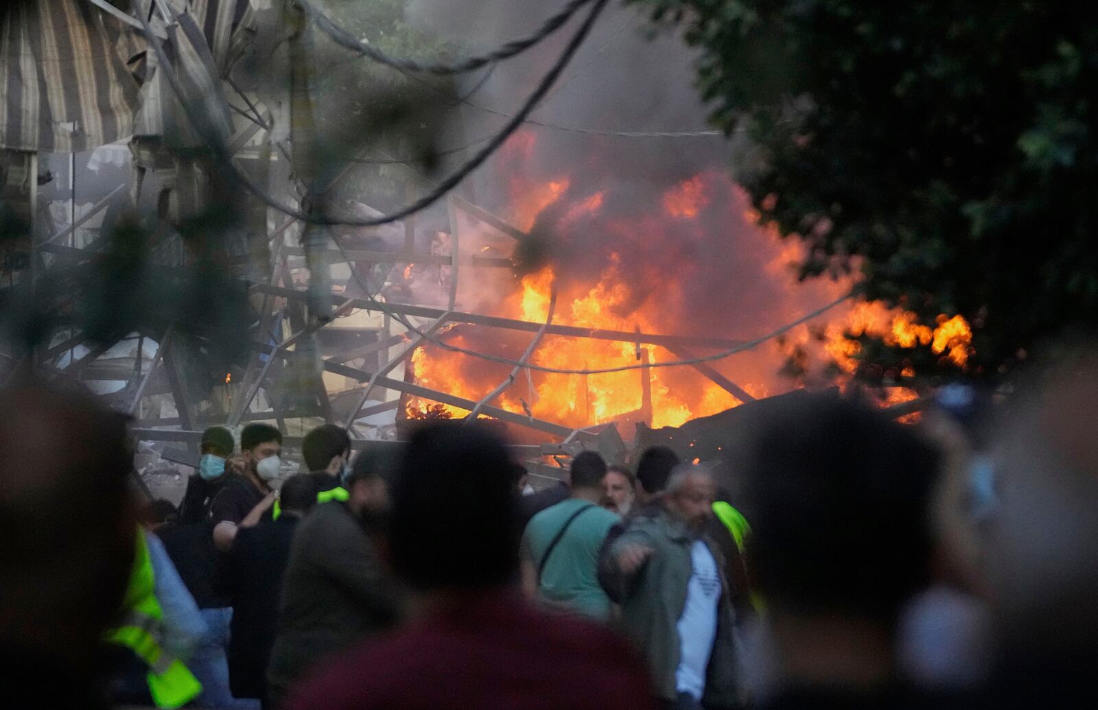 Flames rise from a metal tent that was hit by an Israeli airstrike on Dahiyeh in the southern suburb of Beirut, Lebanon, Sunday, April 27, 2025. (AP Photo/Hussein Malla)