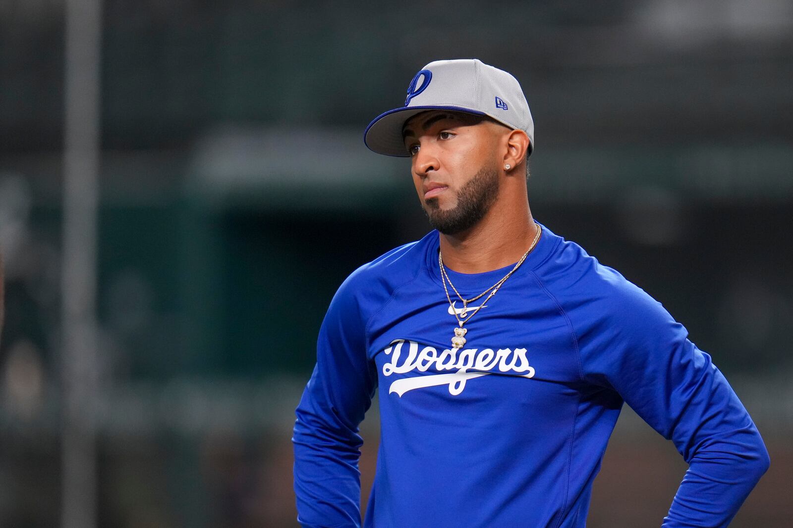 Los Angeles Dodgers designated hitter Eddie Rosario looks on prior to a baseball game against the Texas Rangers Friday, April 18, 2025, in Arlington, Texas. (AP Photo/Julio Cortez)