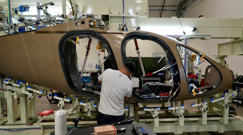 A Joby Aviation employees works on the assembly of an "electric vertical takeoff and landing" eVTOL aircraft in Marina, Calif. on Monday, Oct. 7, 2024. (AP Photo/Terry Chea)