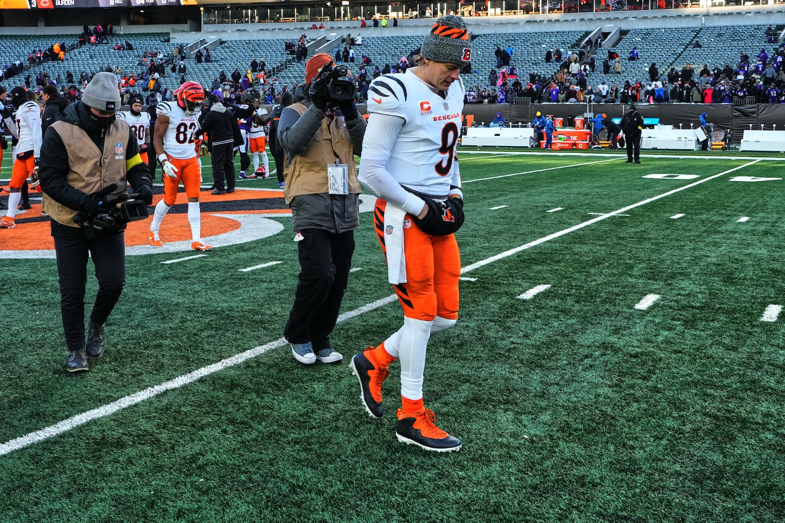 Cincinnati Bengals quarterback Joe Burrow (9) leaves the field after a loss to the Baltimore Ravens in an NFL football game, Sunday, Dec. 14, 2025, in Cincinnati. (AP Photo/Jeff Dean)