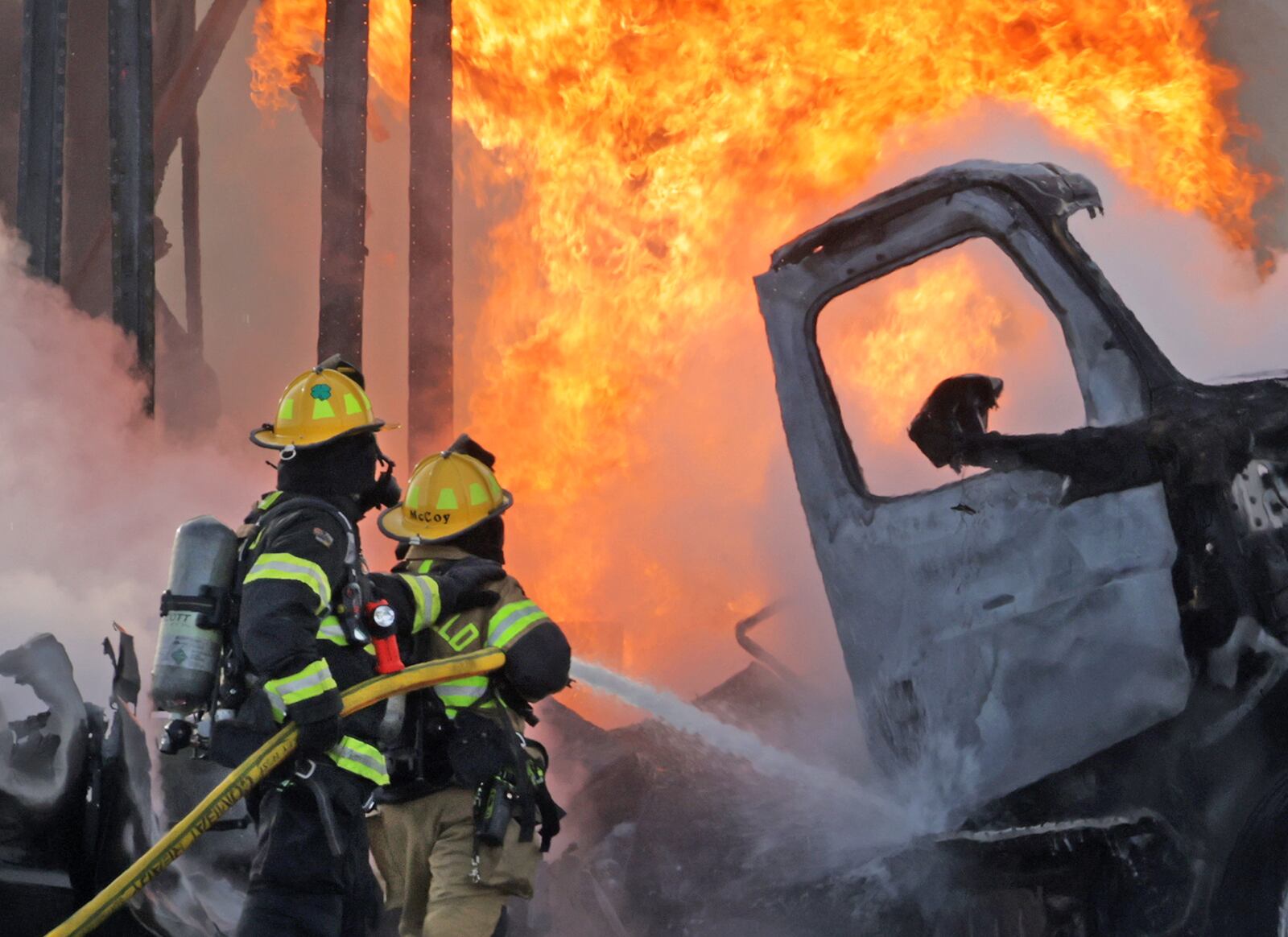 A semi truck and an SUV burst into flames after colliding on Ohio 41 at the Interstate 70 overpass Friday, Feb. 7, 2025. Both occupants escaped with minor injuries. Ohio 41 was closed for several hours while wreck was cleaned up. BILL LACKEY/STAFF