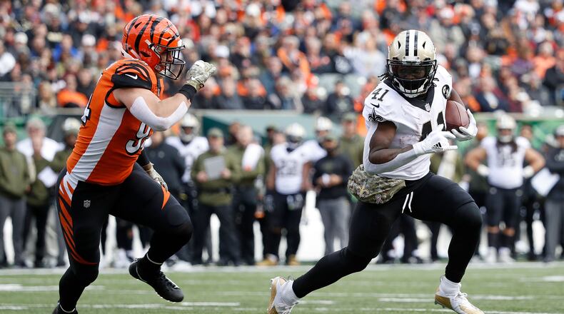 CINCINNATI, OH - NOVEMBER 11: Sam Hubbard #94 of the Cincinnati Bengals runs after Alvin Kamara #41 of the New Orleans Saints during the second quarter at Paul Brown Stadium on November 11, 2018 in Cincinnati, Ohio. (Photo by Joe Robbins/Getty Images)