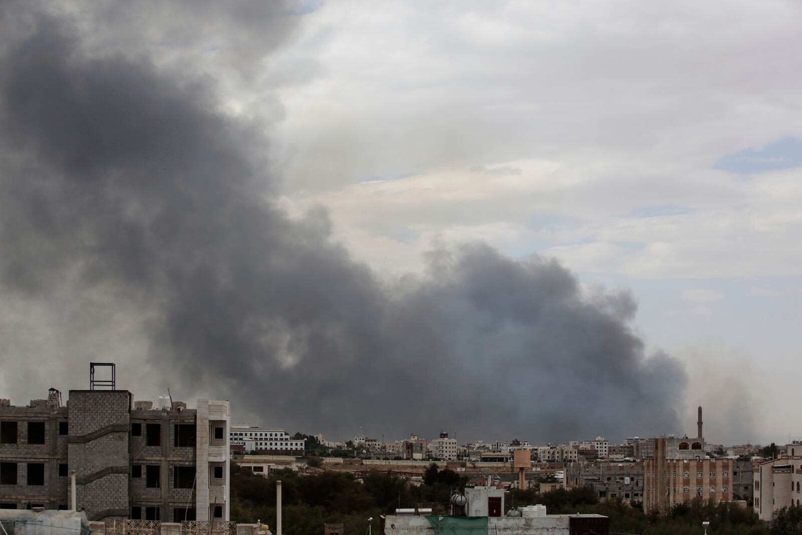 Smoke billows following Israeli airstrikes targeting a power plant and Sanaa Airport, in Sanaa, Yemen, Tuesday, May 6, 2025. (AP Photo/Osamah Abdulrahman)