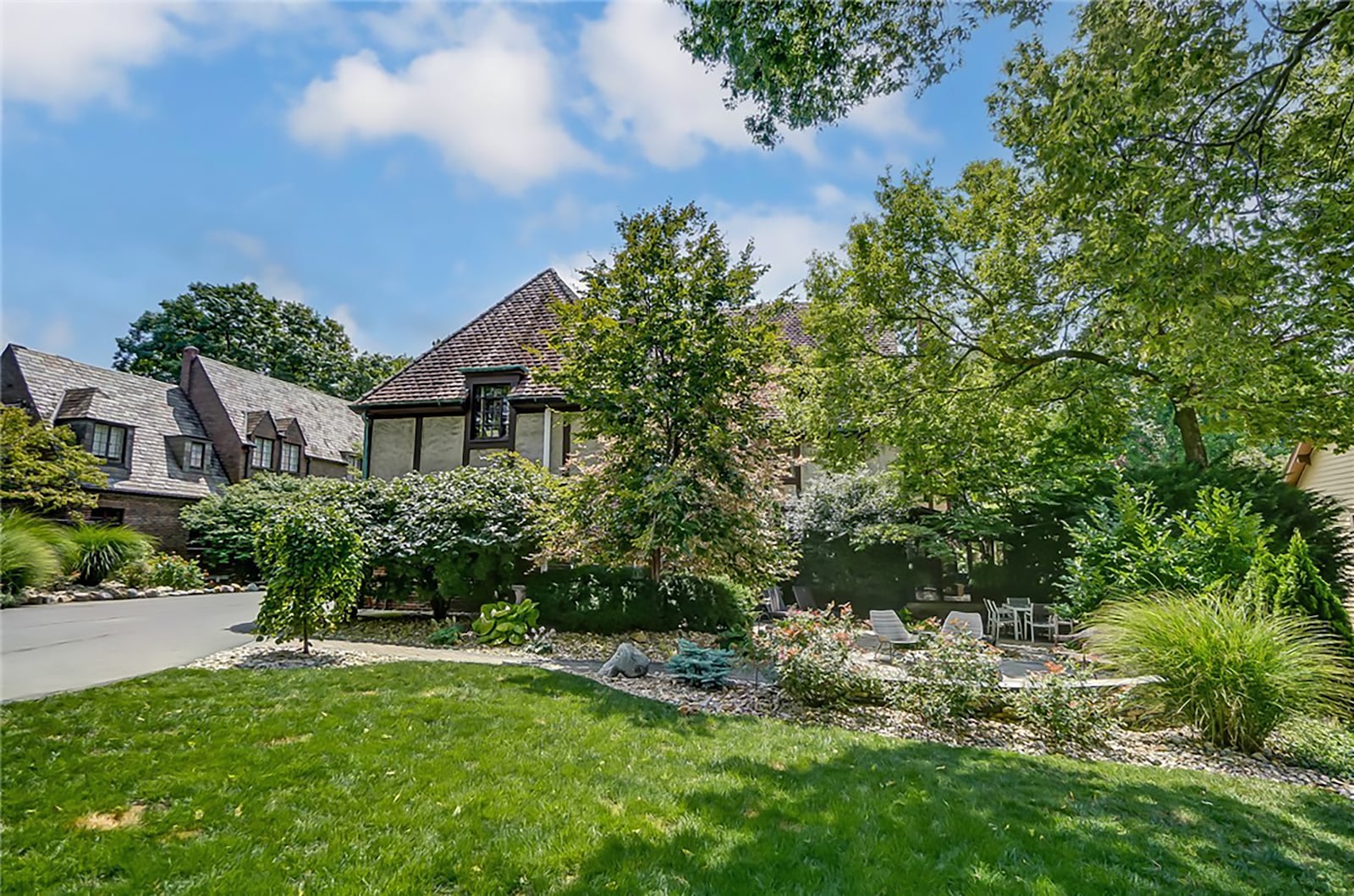 The backyard has paver patios and one with a decorative stacked stone half wall. There is a stone firepit and extensive professional landscaping. CONTRIBUTED