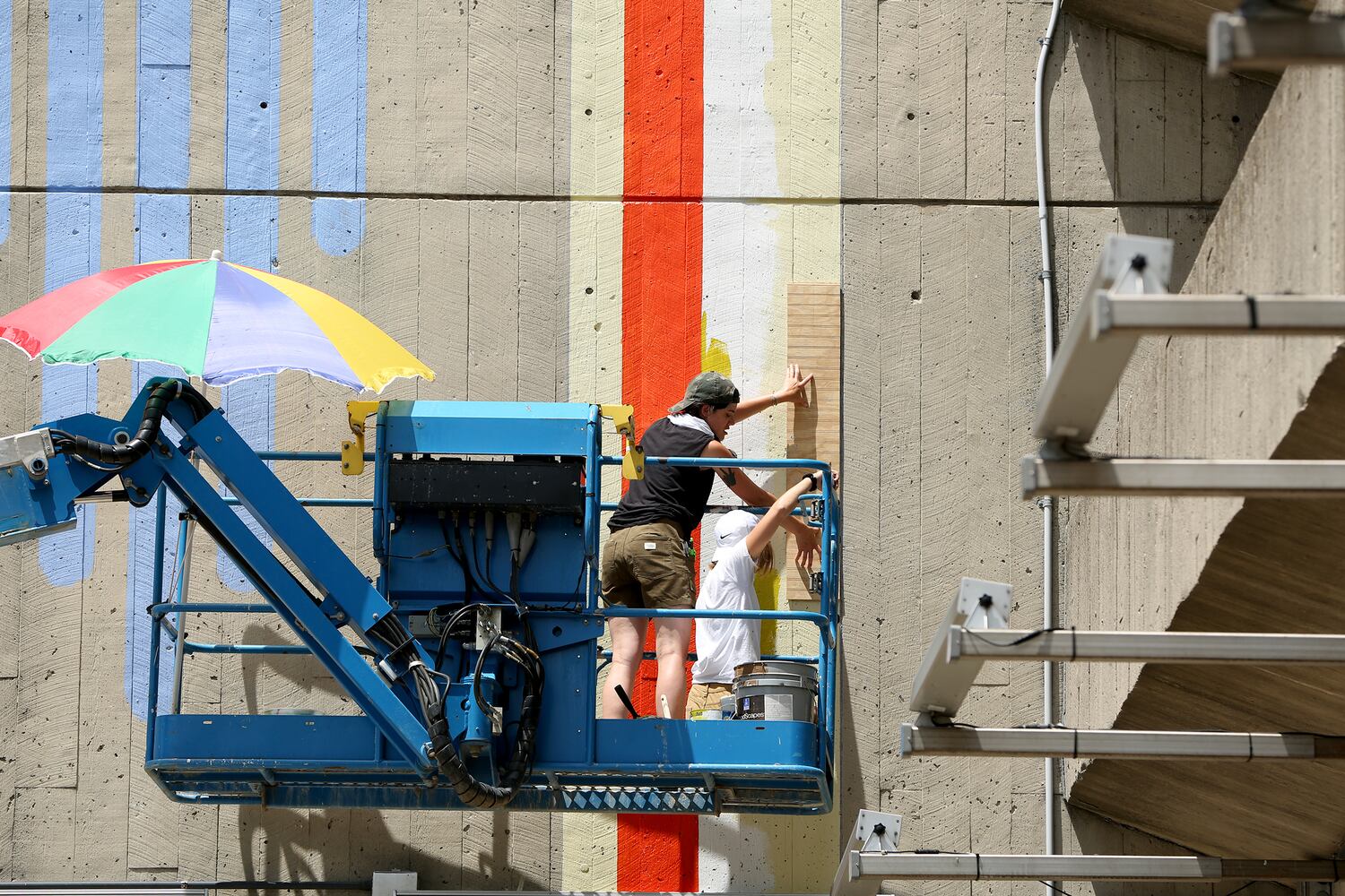PHOTOS: New vibrant mural design energizes Dayton’s transportation center garage