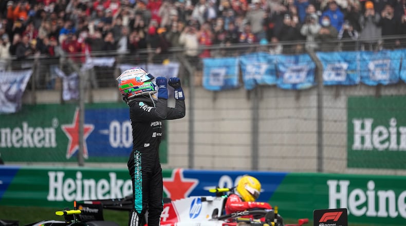 Mercedes driver Andrea Kimi Antonelli of Italy celebrates after he clocked the fastest time in the Chinese Formula One Grand Prix race at the Shanghai International Circuit, in Shanghai, China, Sunday, March 15, 2026. (AP Photo/Andy Wong)
