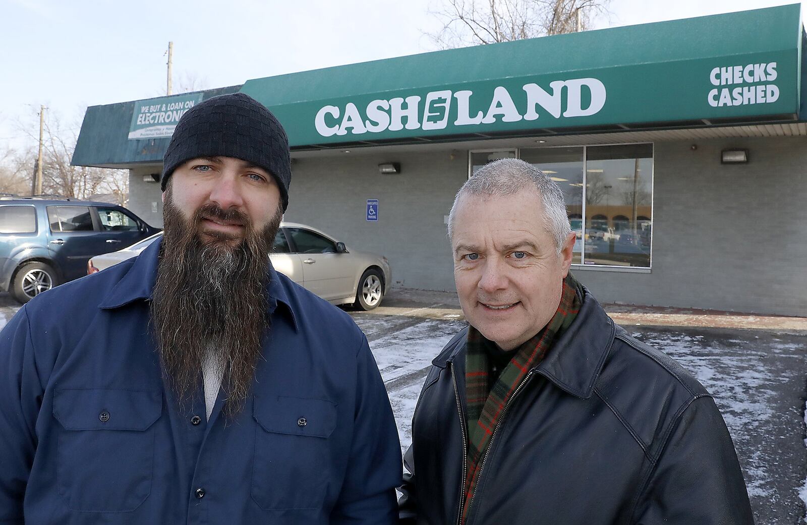 Carl Ruby, pastor of the Central Christian Church, right, and Derek Drewery, pator New Day Christian Fellowship, talk about the high interest rates at payday lenders in the Springifeld area. Bill Lackey/Staff