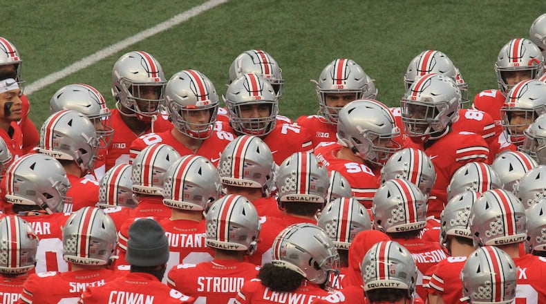 Ohio State players surround Josh Myers as he speaks before a game against Indiana on Saturday, Nov. 22, 2020, at Ohio Stadium in Columbus. David Jablonski/Staff
