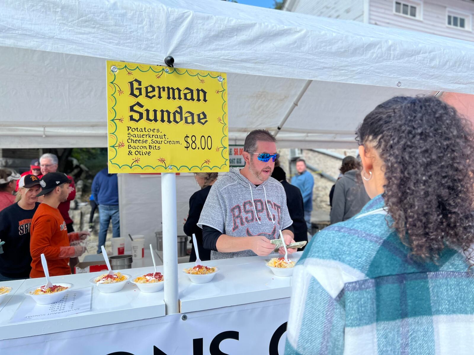 The German sundae booth was a popular stop for festival-goers at the Waynesville Sauerkraut Festival Saturday. AIMEE HANCOCK/STAFF