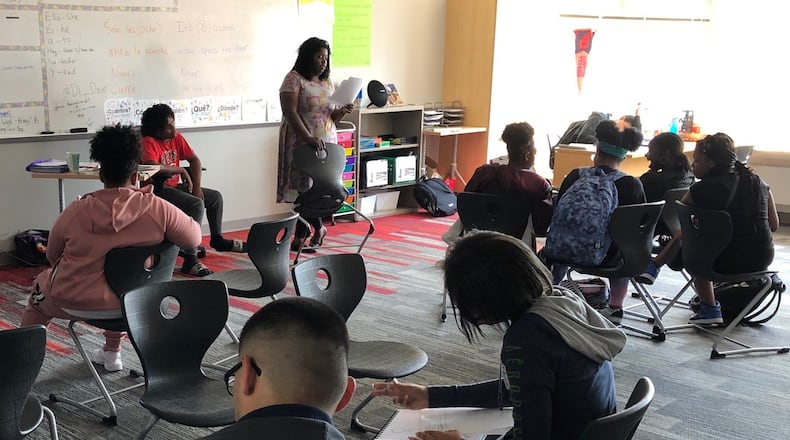 Dayton Early College Academy teacher Maria Ogletree works with her freshman advisory students on questions related to having a growth mindset, Monday, Sept. 16, 2019. DECA was the highest-scoring local charter school on the Ohio Department of Education’s annual school report card. JEREMY P. KELLEY / STAFF
