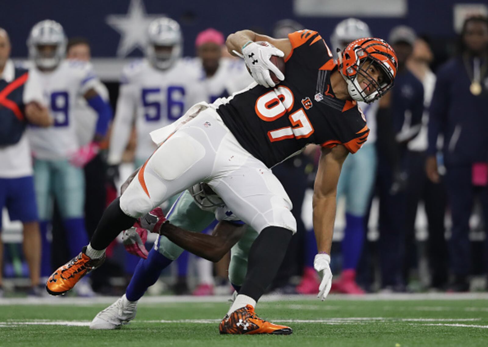 ARLINGTON, TX - OCTOBER 09: C.J. Uzomah #87 of the Cincinnati Bengals runs after catching a pass from Andy Dalton against the Dallas Cowboys at AT&T Stadium on October 9, 2016 in Arlington, Texas. (Photo by Ronald Martinez/Getty Images)