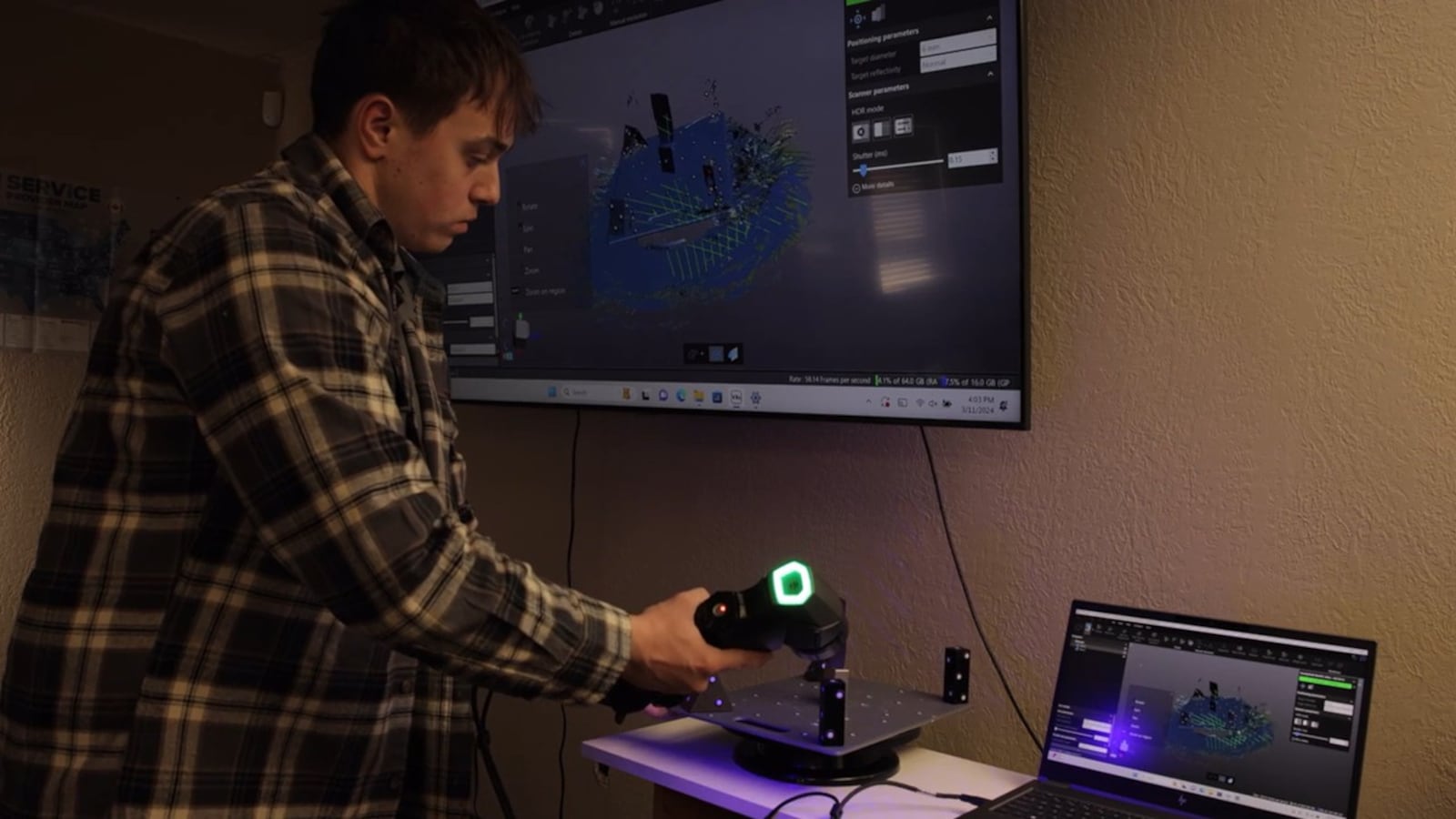 A Hyphen Innovations employee demonstrates scanners and software. The Dayton-area defense firm is preparing for a major facility upgrade with renovations underway at its newly remodeled 6,500-square-foot headquarters at 3250 Kettering Blvd. in Moraine. CONTRIBUTED/Hyphen Innovations.