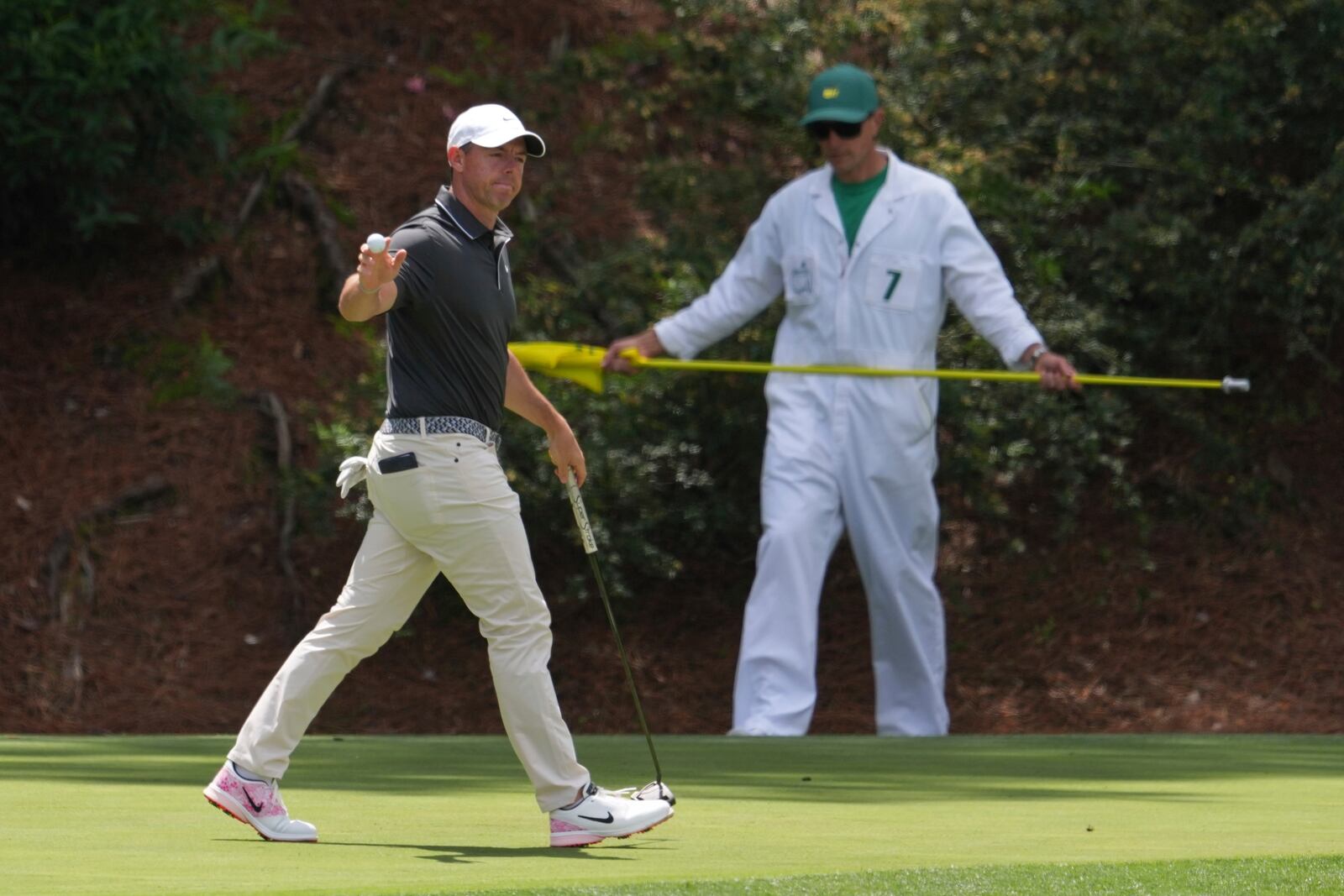 Rory McIlroy, of Northern Ireland, waves after making a putt on the 12th hole during the second round at the Masters golf tournament, Friday, April 11, 2025, in Augusta, Ga. (AP Photo/Matt Slocum)