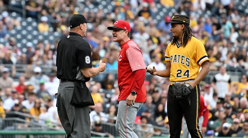 PITTSBURGH, PA - APRIL 07: David Bell #25 of the Cincinnati Reds argues with umpire Jeff Kellogg #8 as Chris Archer #24 of the Pittsburgh Pirates looks on in the fourth inning during the game at PNC Park on April 7, 2019 in Pittsburgh, Pennsylvania. (Photo by Justin Berl/Getty Images)