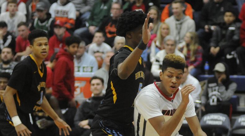 Wayne’s Chandler Fointno (with ball) works around a Huntington Prep defender. Huntington Prep (W.Va.) defeated Wayne 91-60 in Day 2 of the 15th annual Premier Health Flyin’ to the Hoop at Trent Arena in Kettering on Saturday, Jan. 14, 2017. MARC PENDLETON / STAFF