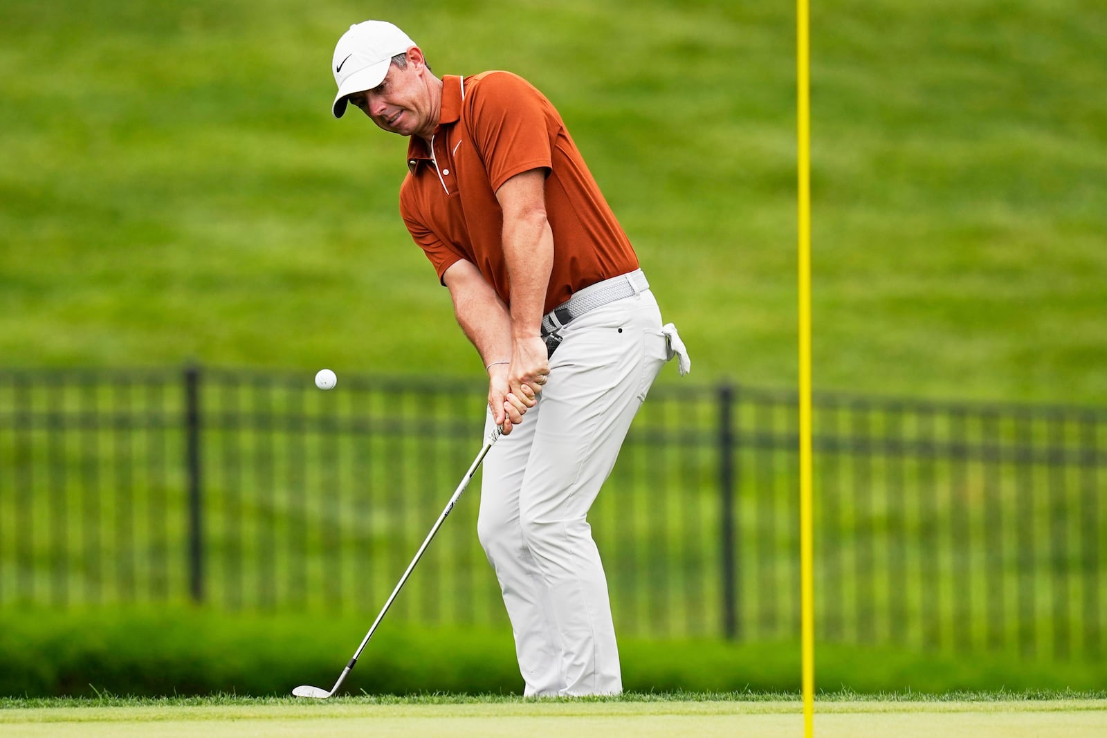 Rory McIlroy, of Northern Ireland, chips to the green on the seventh hole during the second round of the PGA Championship golf tournament at the Quail Hollow Club, Friday, May 16, 2025, in Charlotte, N.C. (AP Photo/David J. Phillip)
