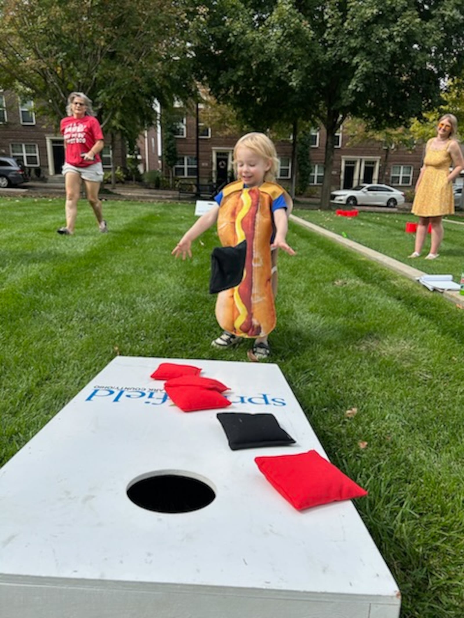 Oliver Flynn came dressed appropriately in a hot dog costume during his visit to the seventh annual MustardFEST with parents Jeff and Katie on Saturday in National Road Commons Park. BRETT TURNER FOR THE NEWS-SUN