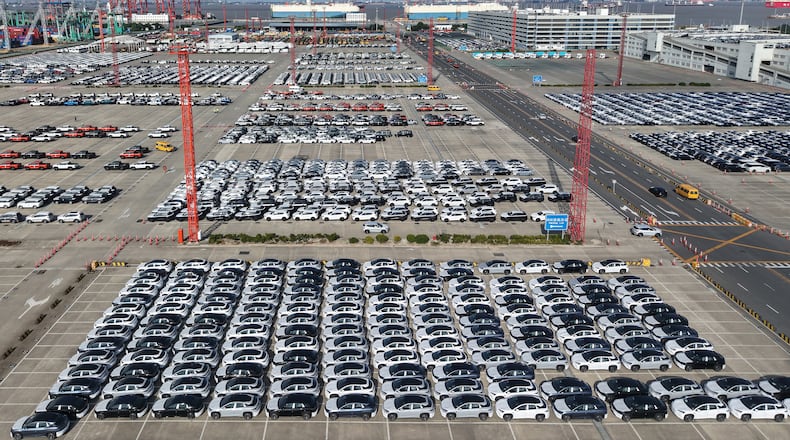 Aerial view of new cars waiting for shipment at a port in Shanghai, China, Wednesday, Jan. 14, 2026. (Chinatopix Via AP)
