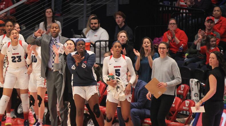 The Dayton bench reacts after a basket during a game against Rhode Island on Feb. 9, 2020, at UD Arena.