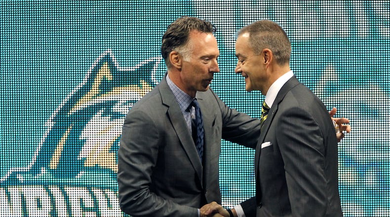 Wright State University Athletics Director Bob Grant (left) introduces Scott Nagy, the new WSU head men’s basketball coach during a press conference Tuesday. Nagy, formerly of South Dakota State, is the ninth head coach in the history of the Raiders men’s basketball program. LISA POWELL / STAFF