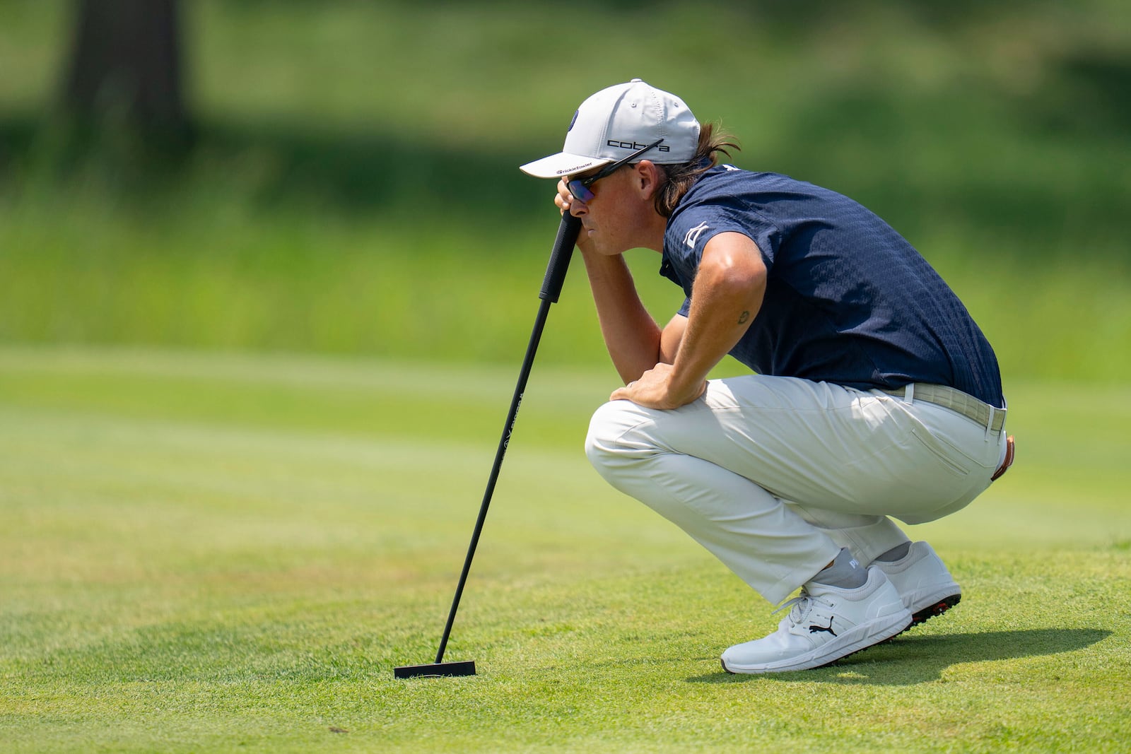 Rickie Fowler lines up a putt on the third green during the second round of the 3M Open golf tournament at TPC Twin Cities in Blaine, Minn., Friday, July 25, 2025. (Alex Kormann/Star Tribune via AP)