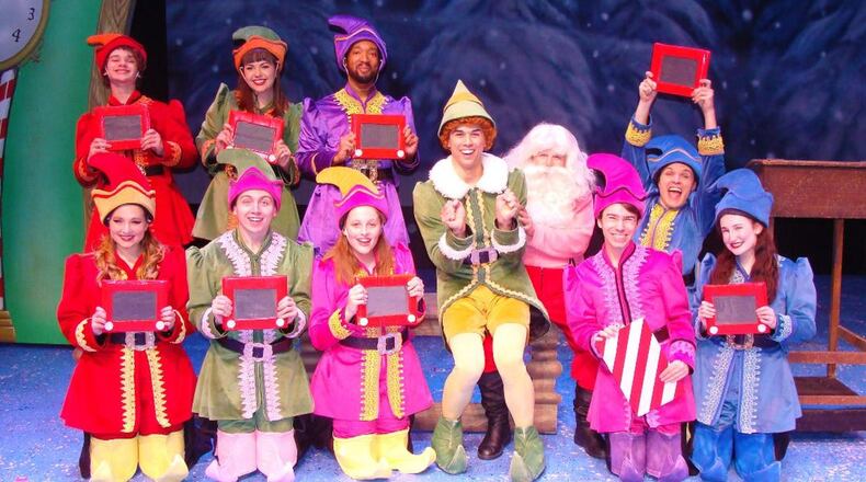 David Thomas (center as Buddy) and the cast of La Comedia Dinner Theatre's production of "Elf: The Musical," continuing through Dec. 31 in Springboro. CONTRIBUTED/JUSTIN WALTON