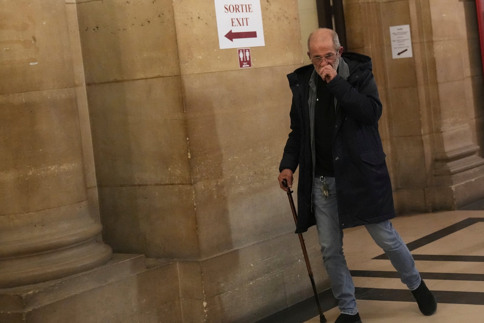 Defendant Aomar Aït Khedache, one of the men accused in the 2016 armed robbery of Kim Kardashian, leaves after the verdict in the trial of Kim Kadashian heist, Friday, May 23, 2025 in Paris. (AP Photo/Christophe Ena)
