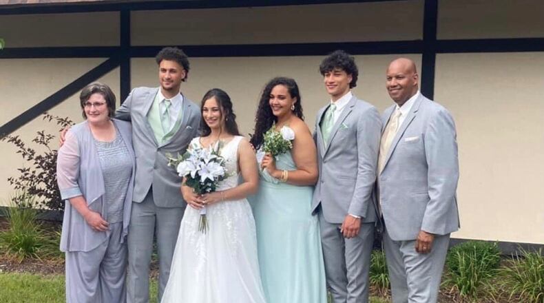 The Santos Family at Ashley’s wedding. (left to right) Lori (mom), K.J., Ashley, Sydney, Nate and Joe (dad). CONTRIBUTED