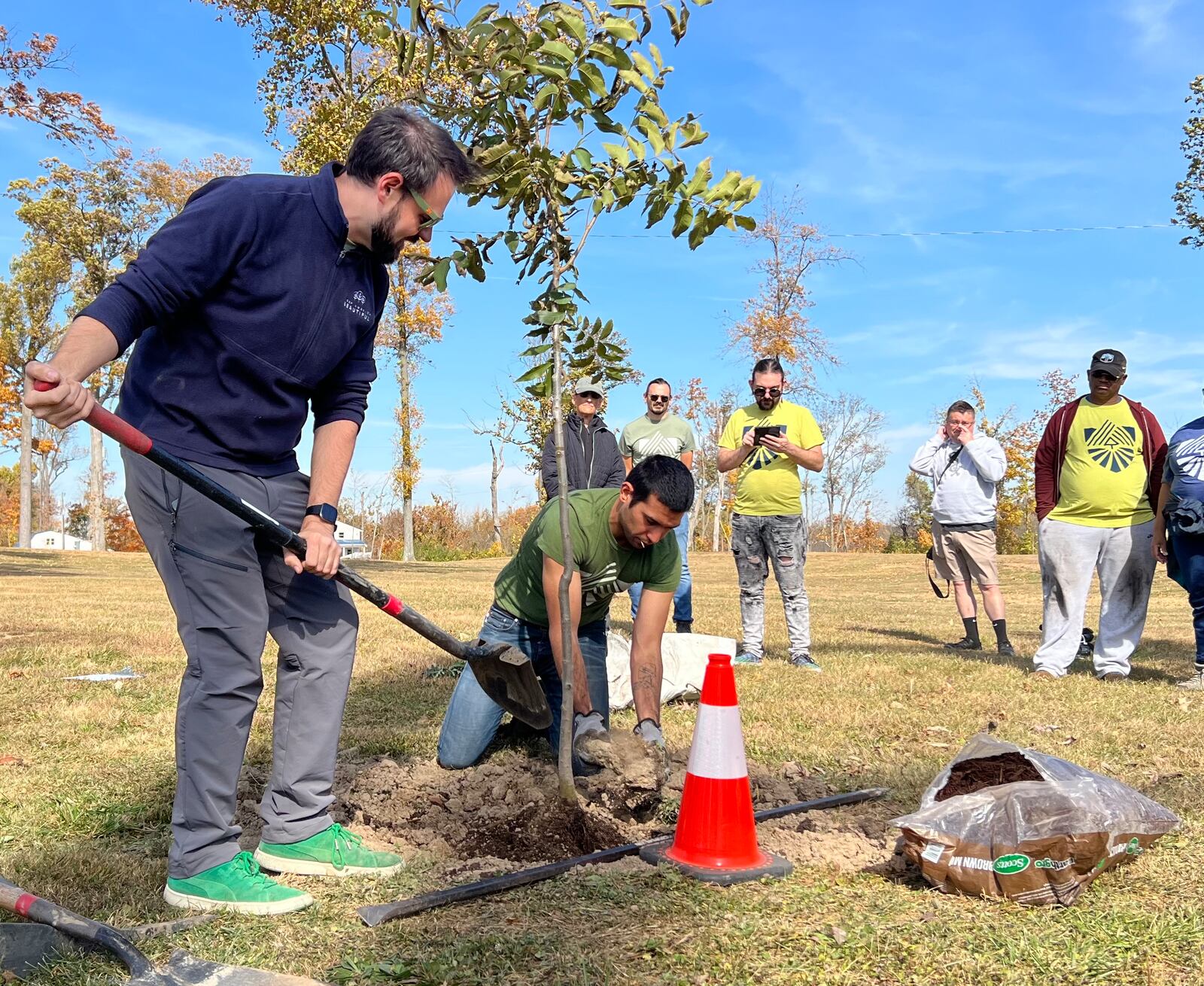 Volunteers for Saturday's TREEcovery Campaign planting event get briefed on tree planting techniques by RETREET Director Grady McGahan, left, before heading out into the community. AIMEE HANCOCK/STAFF