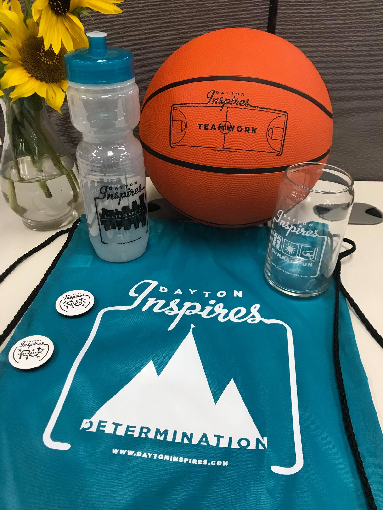 Dayton Inspires is giving away free Dayton swag this afternoon.