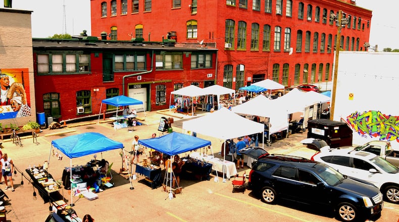 Dayton's art district on Front Street hosted a Father's Day Art Hop and Beer Garden on Sunday, June 18. Over 250 artists and vendors opened their studios and shops for the third annual event. Local food trucks and Fifth Street Brew Pub supplied the food and beer for the visitors to Front Street. DAVID A. MOODIE/CONTRIBUTING PHOTOGRAPHER
