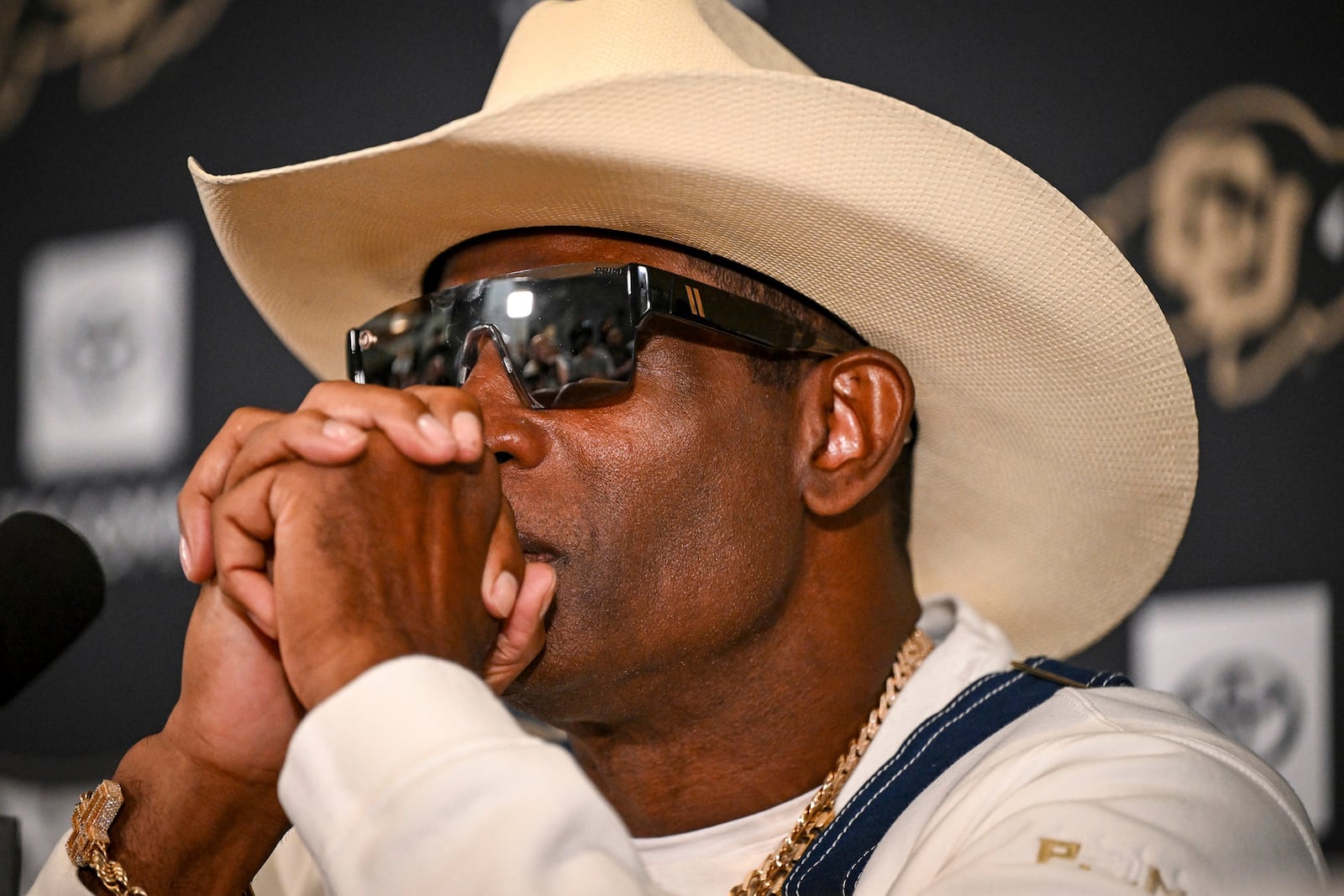 Colorado head coach Deion Sanders considers a question during a news conference to discuss his journey in beating bladder cancer Monday, July 28, 2025, in Boulder, Colo. (AAron Ontiveroz/The Denver Post via AP)/