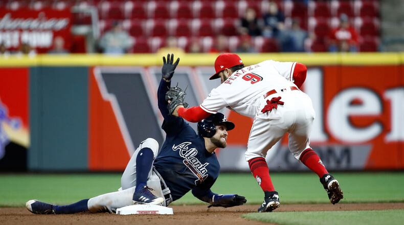 CINCINNATI, OH - APRIL 25: Ender Iciarte #11 of the Atlanta Braves slides safely in to second base ahead of the tag by Jose Peraza #9 of the Cincinnati Reds for a stolen base in the 7th inning at Great American Ball Park on April 25, 2018 in Cincinnati, Ohio. (Photo by Andy Lyons/Getty Images)
