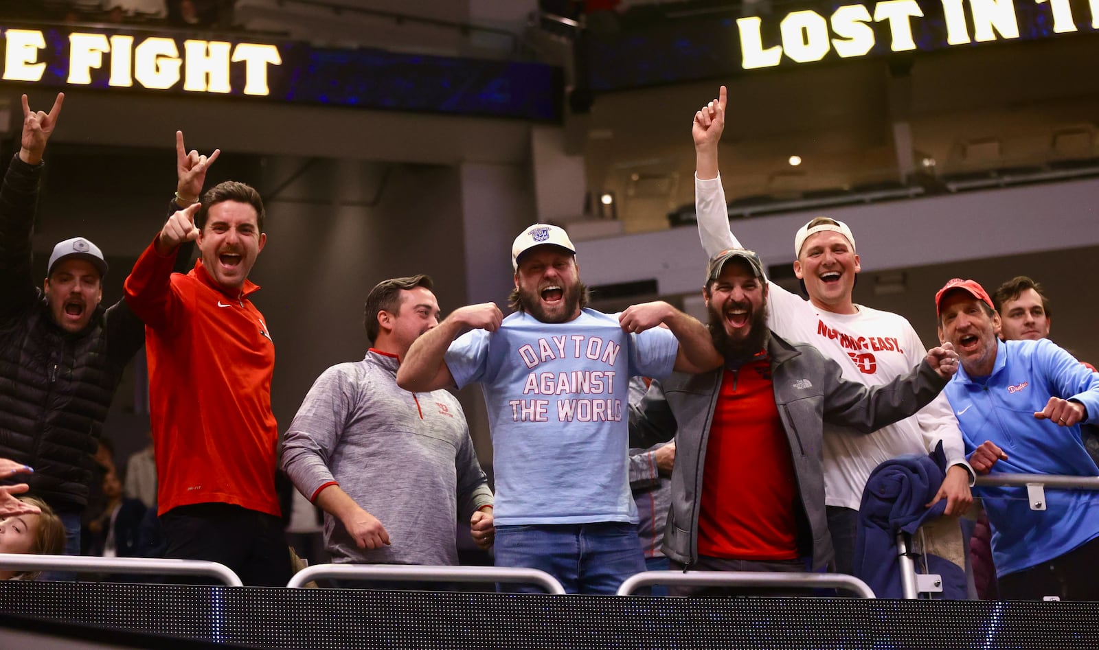 Dayton fans celebrate after a victory against Marquette on Wednesday, Nov. 19, 2025, at Fiserv Arena in Milwaukee, Wis. David Jablonski/Staff