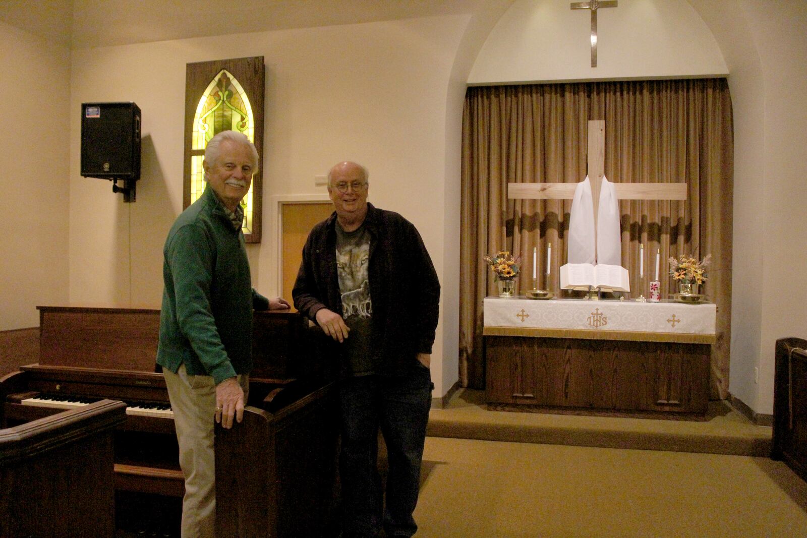 Todd Trautwein and Tom Devers, members of Trotwood United Church of Christ, stand in the church sanctuary the day before the building was sold to Philip's Temple Church.