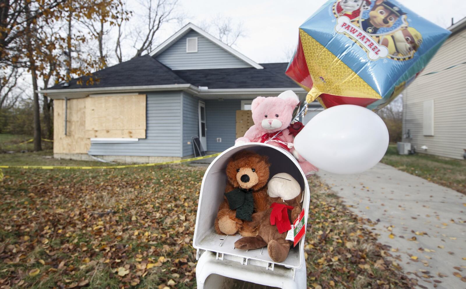 A mailbox has been turned into memorial of stuffed animals and balloons where a car plowed into a Lilac Avenue house in Dayton last week resulting in the death of Maria Davis, 39, and her 7-year-old son, Jerome. CHRIS STEWART / STAFF